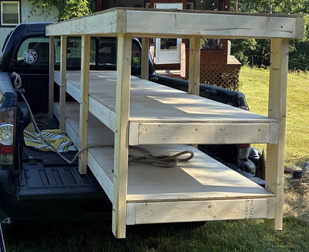 The unfinished workbench secured in the pickup bed.