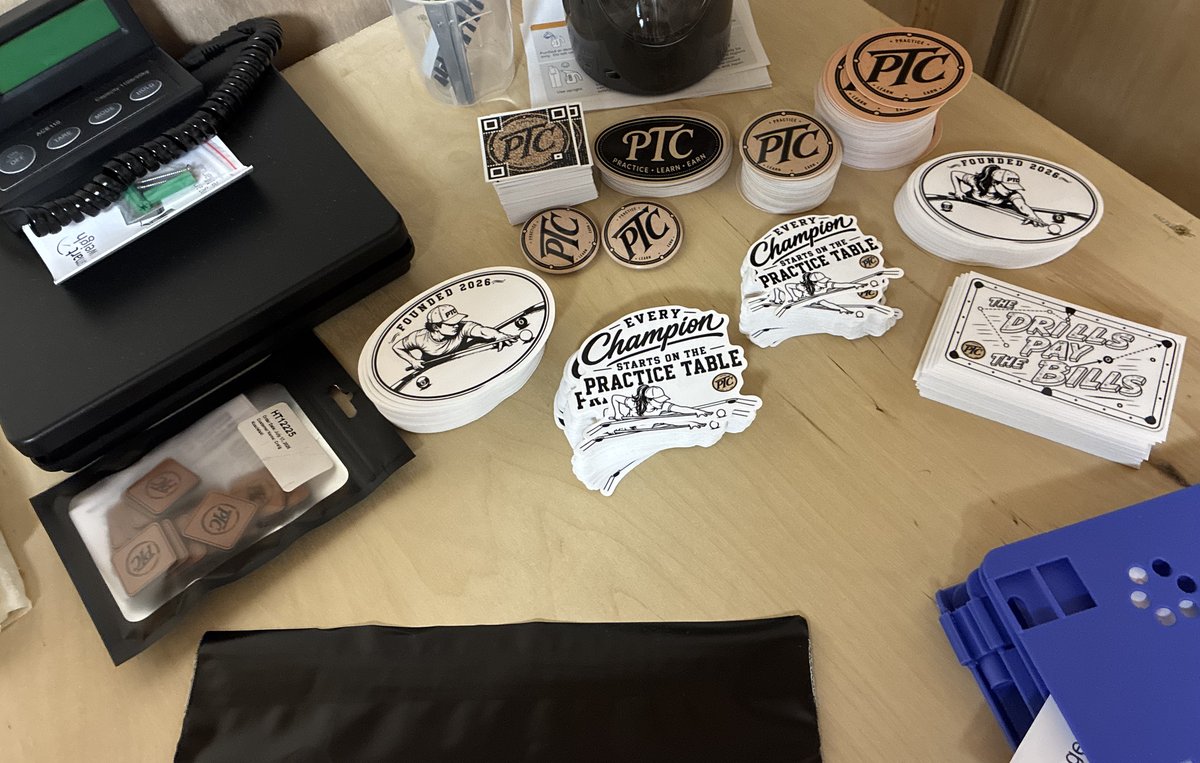 PTC stickers and packaging pieces arranged on the bench.