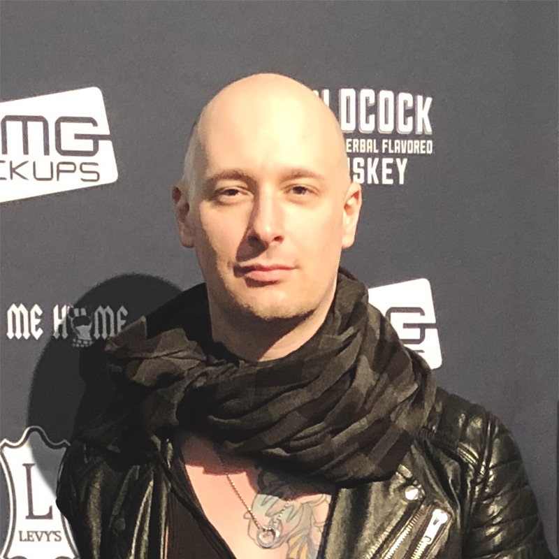 Alex Millar standing on the red carpet at NAMM.