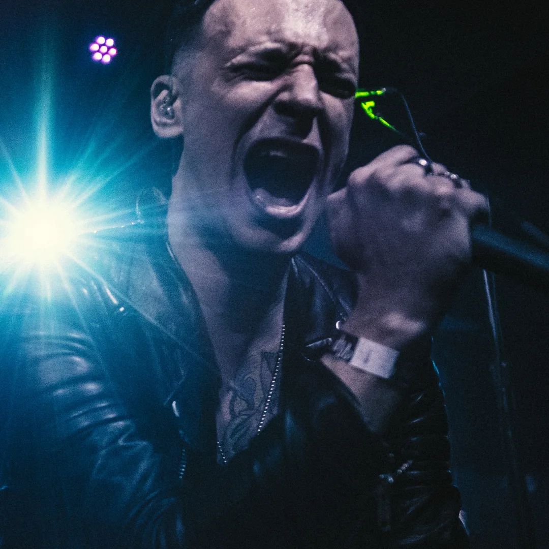 Alex Millar singing on stage.