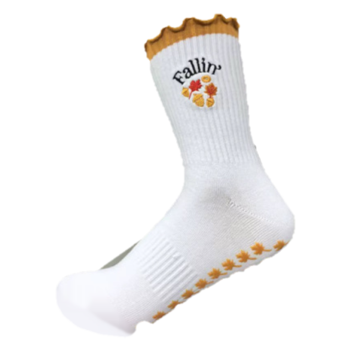 Fallin' grip sock with autumn leaf embroidery and orange grips