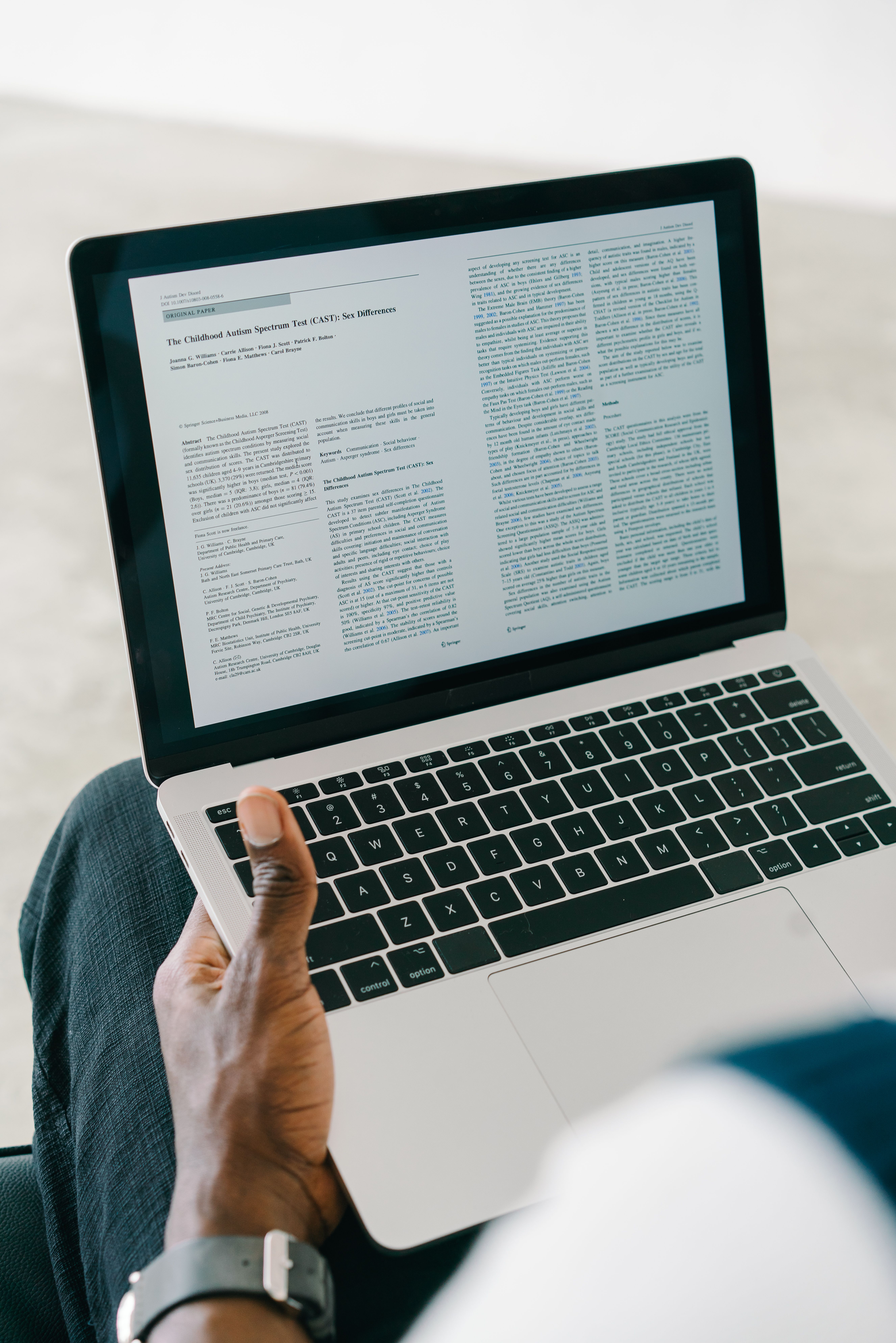 Book interior layout being prepared on a laptop for publication
