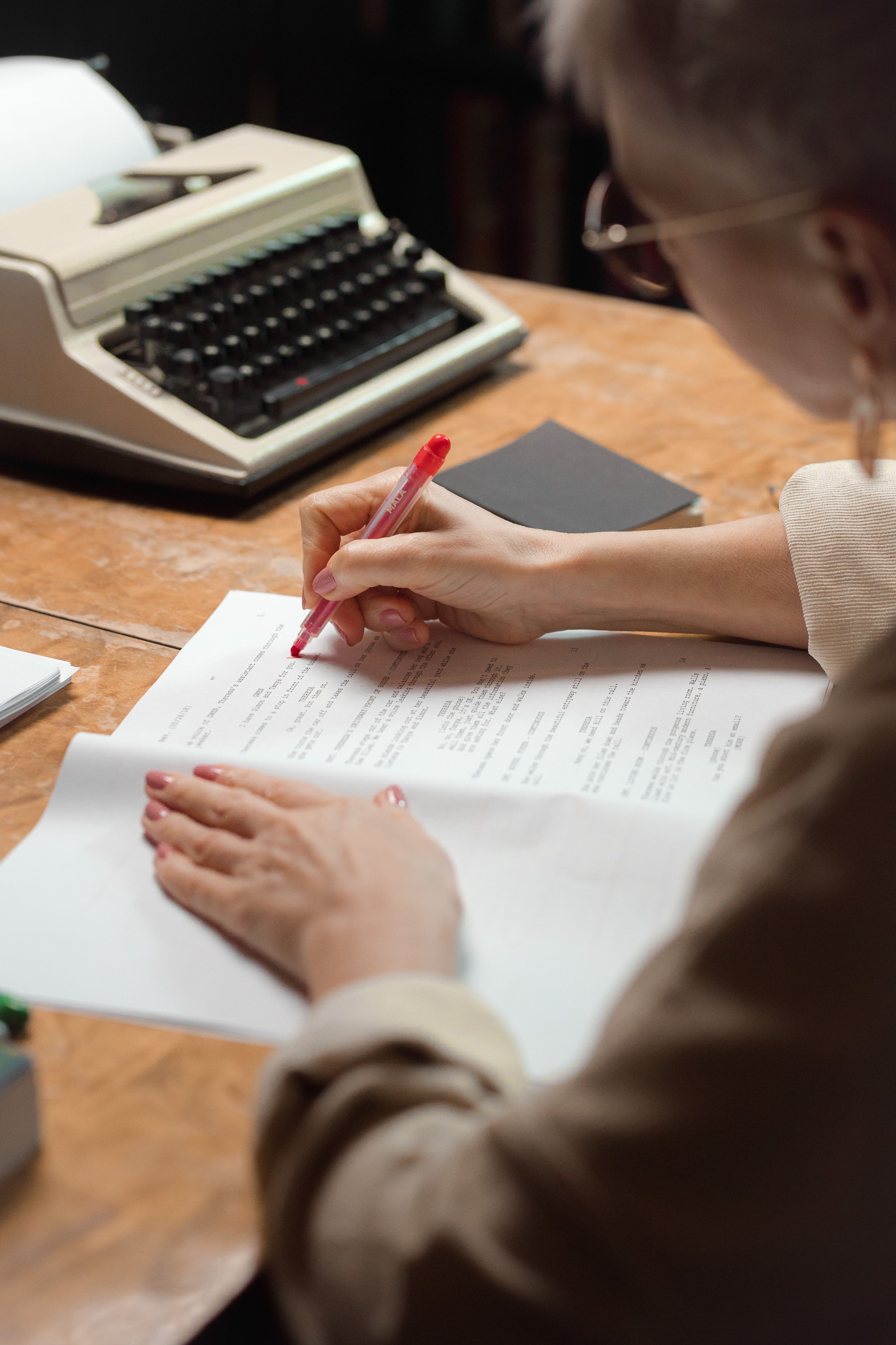Editor reviewing and preparing a manuscript for publication