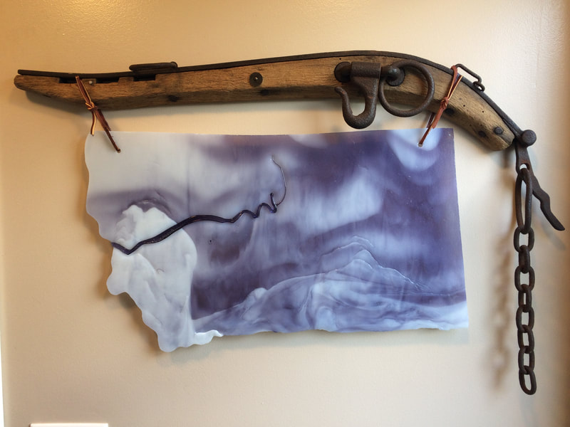 Montana glass hanging from harness hame.
