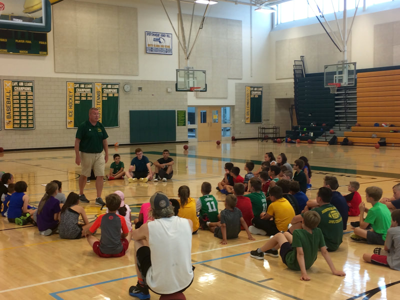 NRHS Boys Coach Joe Casey speaks to the campers about how special it is to play for your hometown.