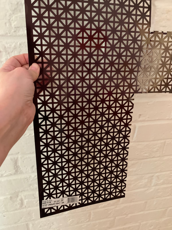 This metal is sold in sheets at Home Depot, Lowe's, etc. It comes in several different patterns as well as plain. You don't want plain -- you need the perforations so the candle will get oxygen.