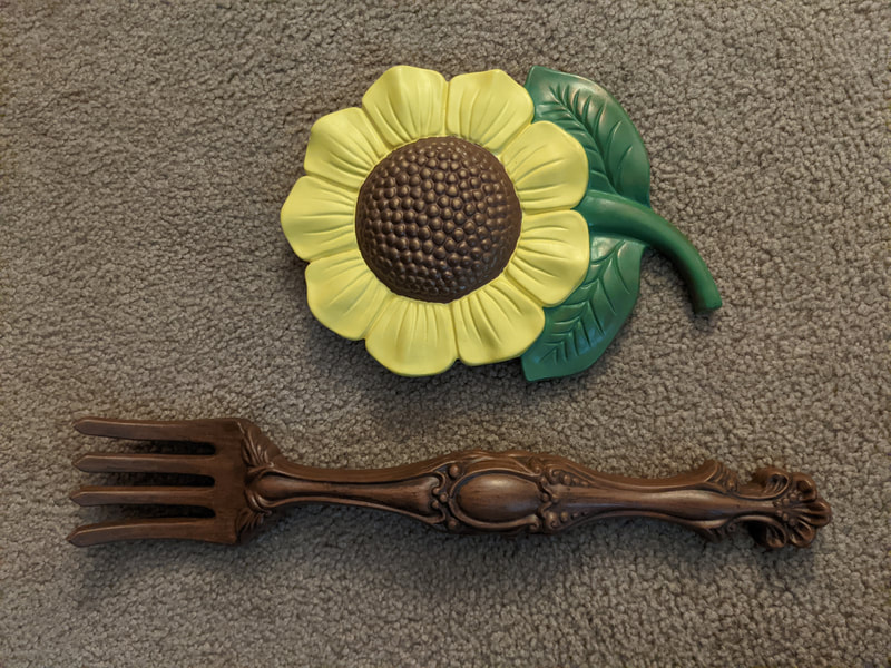 Large sunflower and fork wall hangings