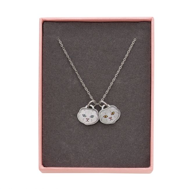A necklace of Olivia and Meredith Swift, Taylor Swift's cats.