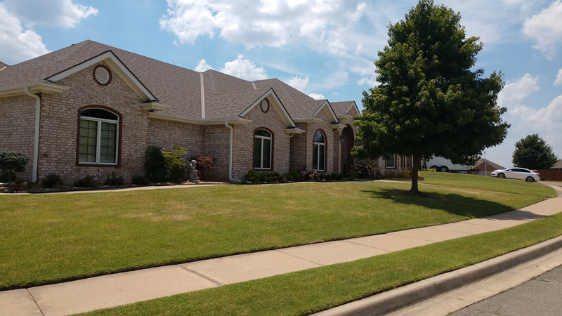 Beautiful corner lot. Sidewalk nicely edged