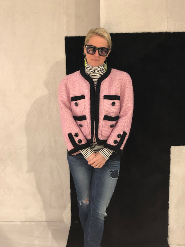 Posing against a wall rug at a Trade Show!