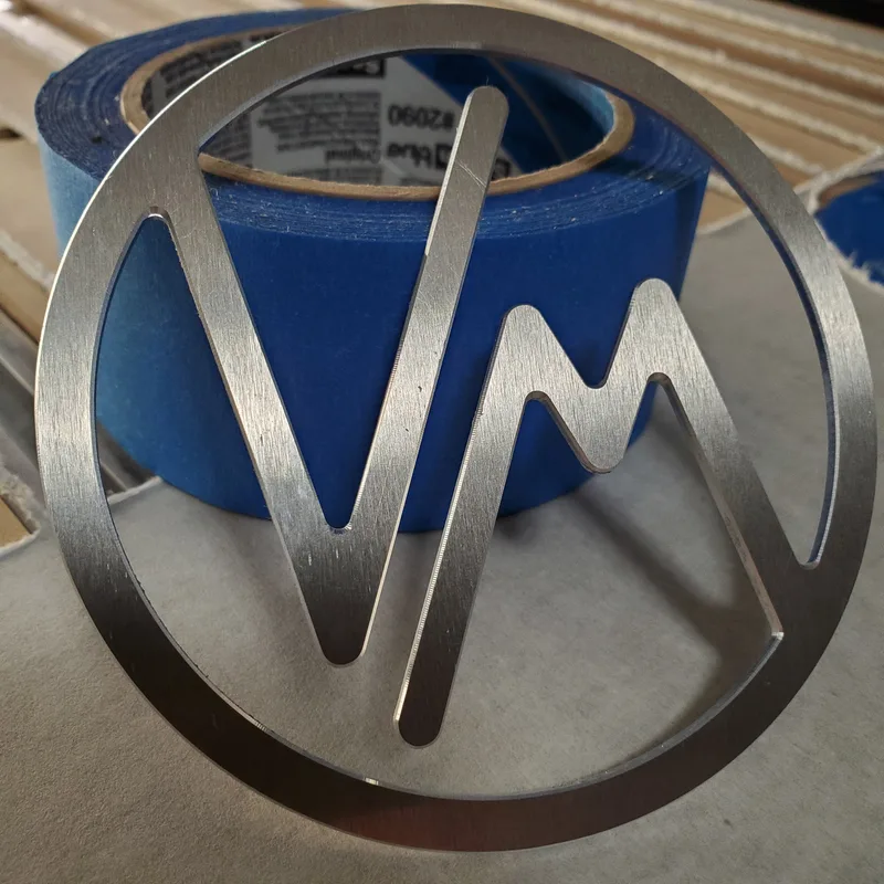 cnc router cut solid aluminum customer logo with chamfered edges