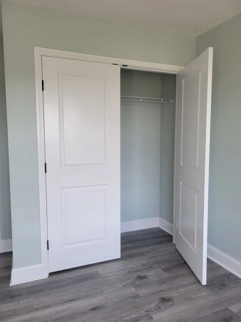 A freshly updated closet featuring newly painted walls and doors for a clean, smooth, and modern finish. The project included full surface preparation, precise cutting lines, and a uniform application that brightens the room and enhances the overall space