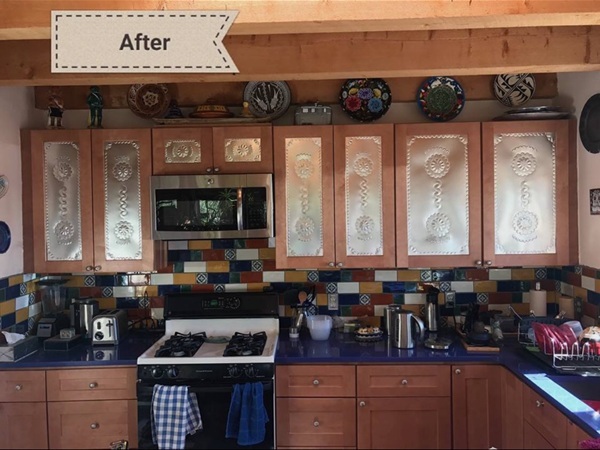 Kitchen remodel featuring custom island with granite countertop, modern cabinetry, new exhaust hood, and updated ceiling lighting