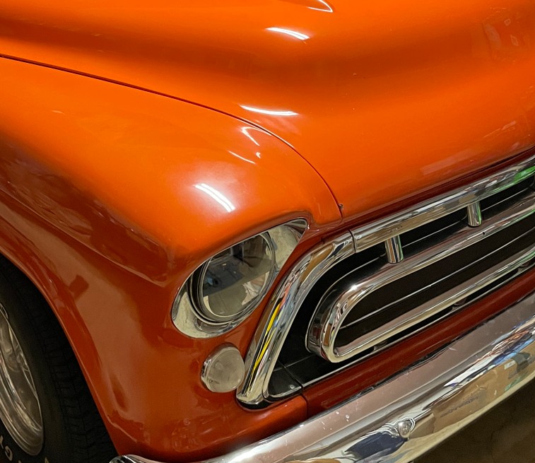 Front right grill and headlight 1957 Chevy pickup orange.