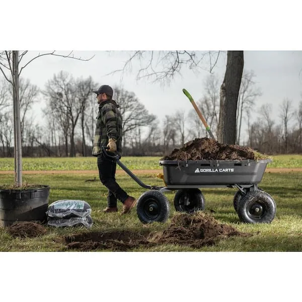 A person pulling their garden cart at work.