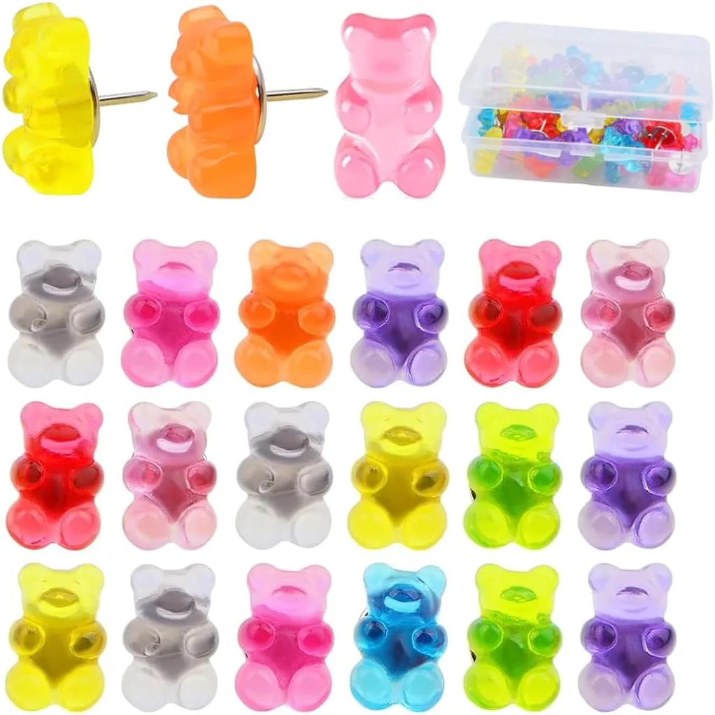 Gummy bear push pins all lined up in various colors like, grey, pink, orange, purple, red, yellow, and green.