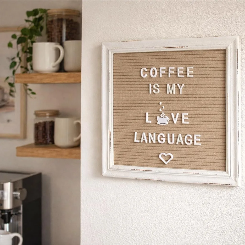 Felt letter board mounted on a wall with a note saying, 