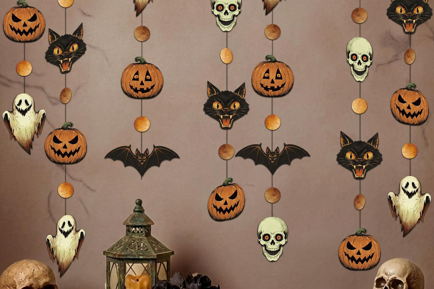 Four vintage-style Halloween garlands featuring ghosts, bats, skulls, black cats, and pumpkins in orange and black.