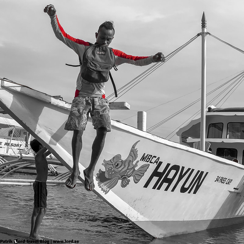 Dauin, Guy jumps from a boat, Negros, Philippines © Patrik Lord Travel Blog