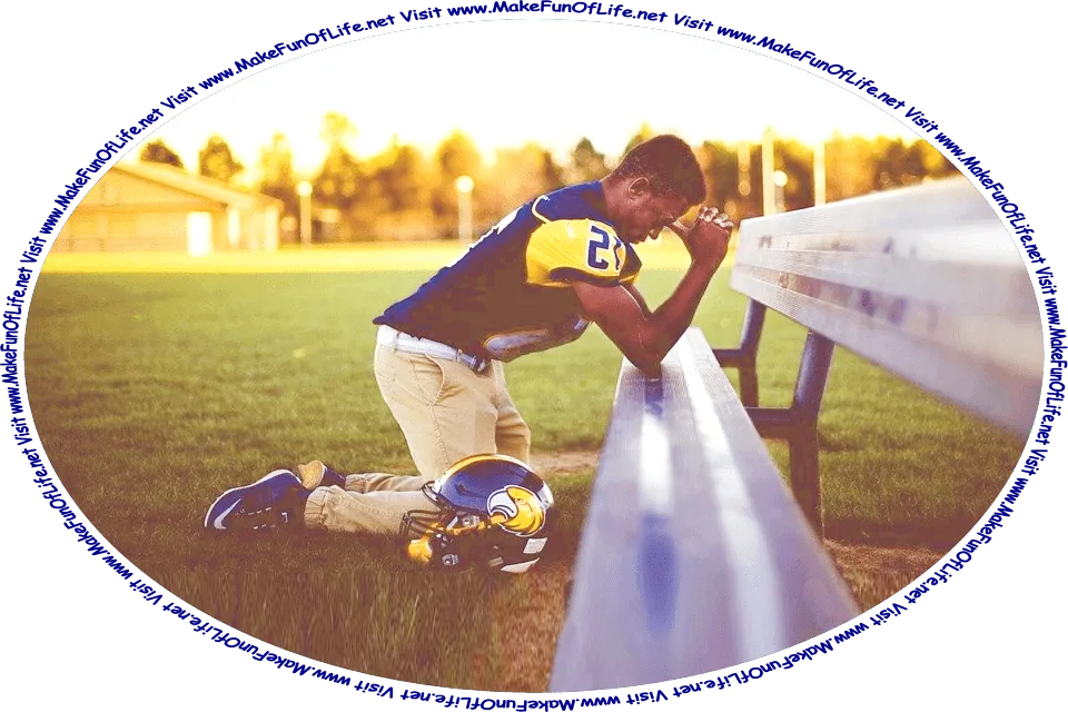 Picture of a football player in a blue and gold color uniform, with helmet resting on the ground next to him, while kneeling in prayer, his elbows resting on a bench, on a grassy field, and the words, ‘Visit www.MakeFunOfLife.net.’