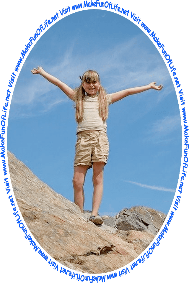 Picture of a happy smiling girl standing outside on top of large rocks, with a slightly hazy blue sky in the background, and the words, 'Visit www.MakeFunOfLife.net.'