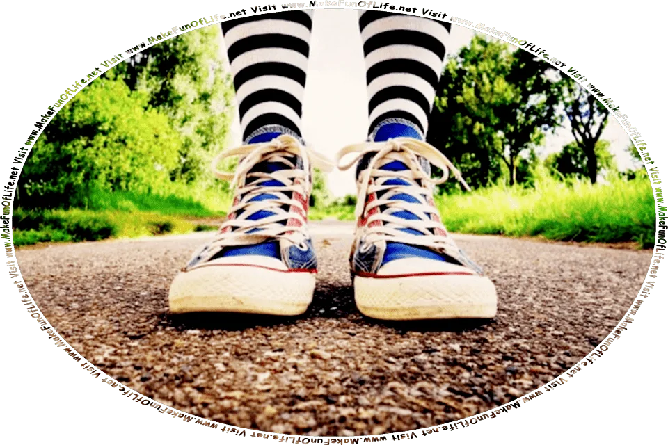 Picture of a person walking on an asphalt-paved path, with green grass and green leafy trees on each side of it, and the words, Visit www.MakeFunOfLife.net.
