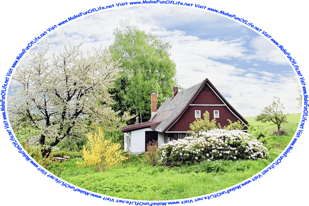 Picture of a country cottage surrounded by flowering trees and bushes and green grass, with a table and benches under a tree a short distance from the cottage door, a blue sky with small fluffy white clouds, and the words, ‘Visit www.MakeFunOfLife.net.’
