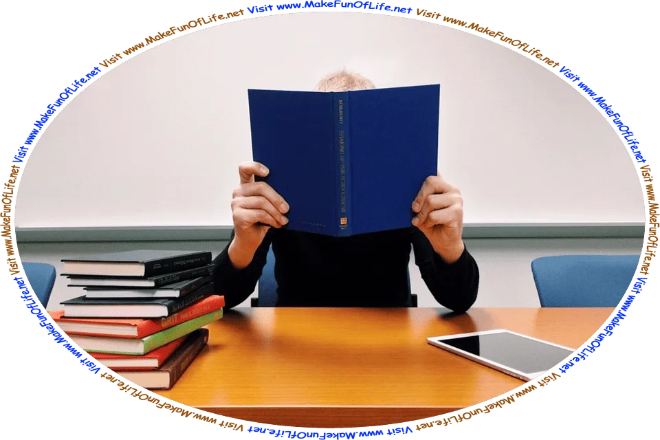 Picture of a student holding up an open book to hide behind, and the words, ‘Visit www.MakeFunOfLife.net.’