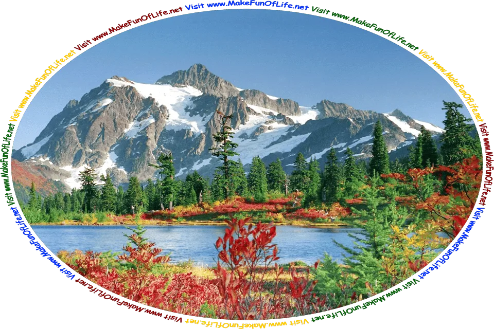 Picture of a blue lake surrounded by trees with dark red leaves and evergreen trees, mountains partly covered with snow in the distance, a clear blue sky above, and the words, ‘Visit www.MakeFunOfLife.net.’