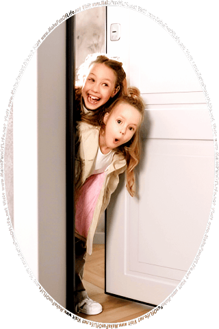 Picture of two happy smiling girls peering out from behind a partially open door, and the words, Visit www.MakeFunOfLife.net.