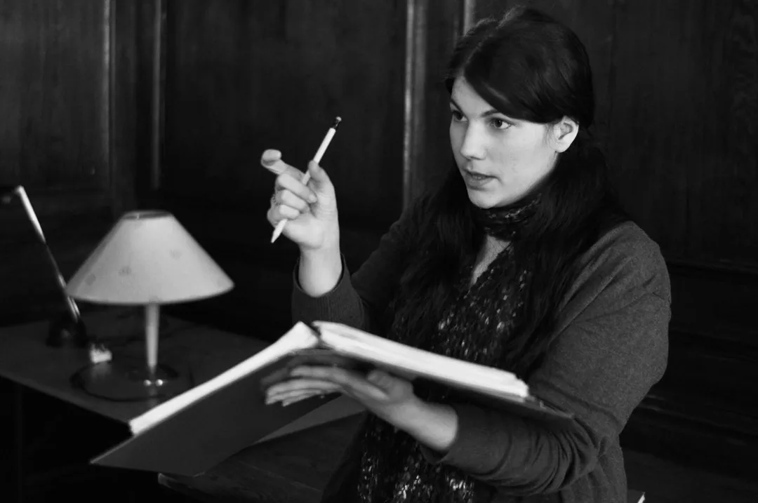 A theatre director gives instructions to performers.