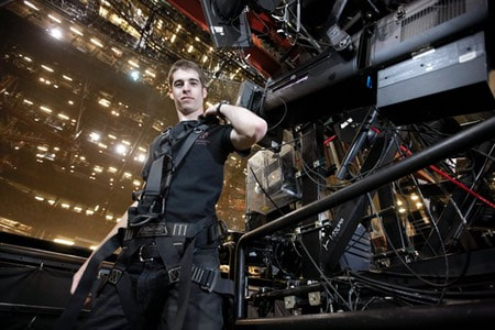 A stagehand suits up to do his work.