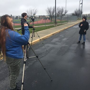 Student filmmakers capture two types of shots at once. 