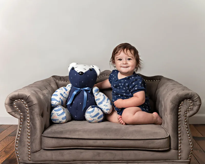 photo of a memory bear by the pretty piggy shop on etsy and a 1 year old baby boy photographed by Laura Pea Photography