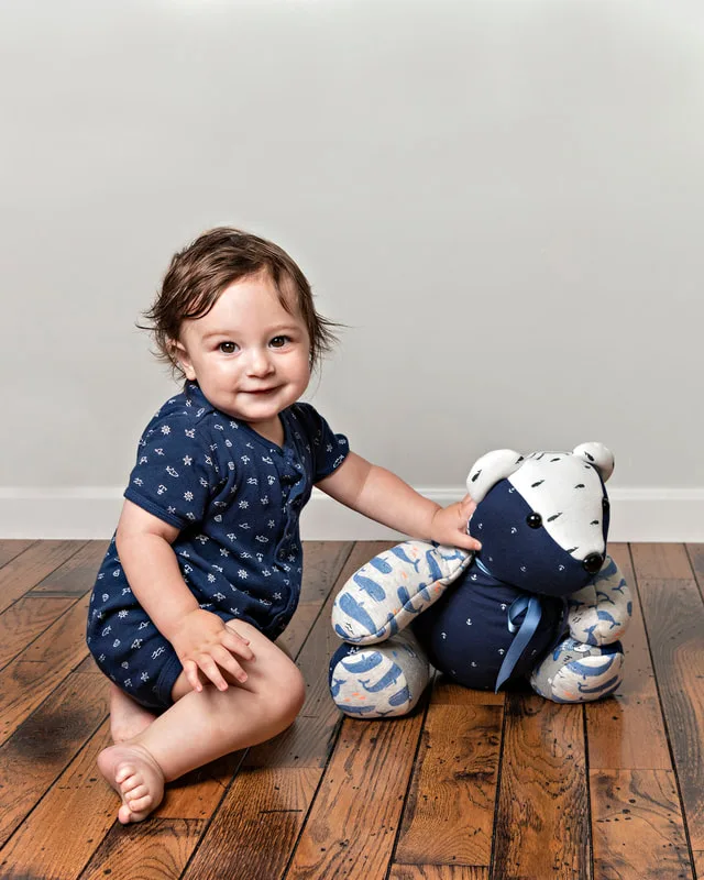photo of a memory bear by the pretty piggy shop on etsy and a 1 year old baby boy photographed by Laura Pea Photography