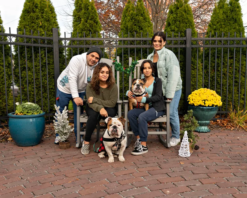 photo of a family with their bulldogs