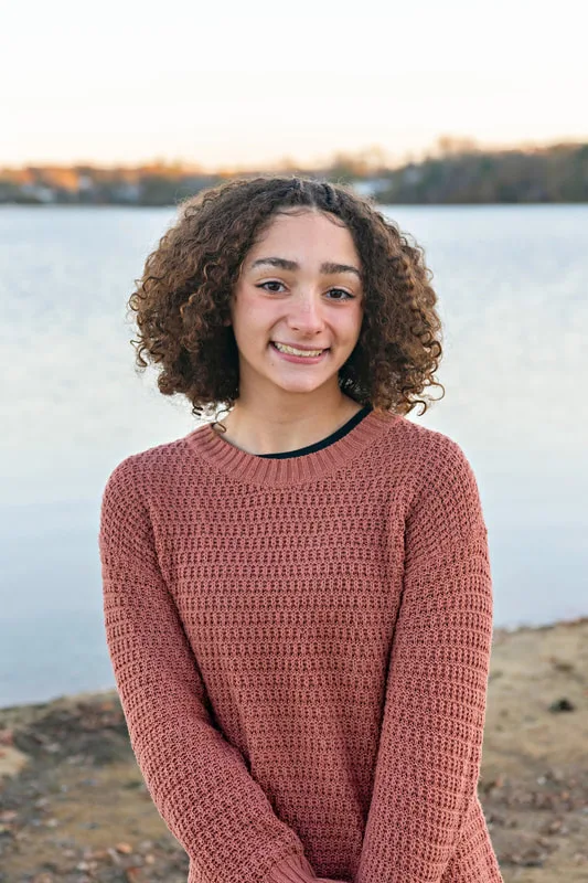 color photo of a teenage girl  looking at the camera straight on. Portrait taken by Long Island pet photographer Laura Pea Photography