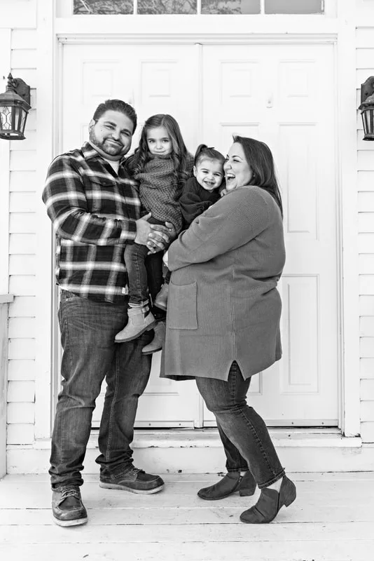 photo of a family of four in black and white