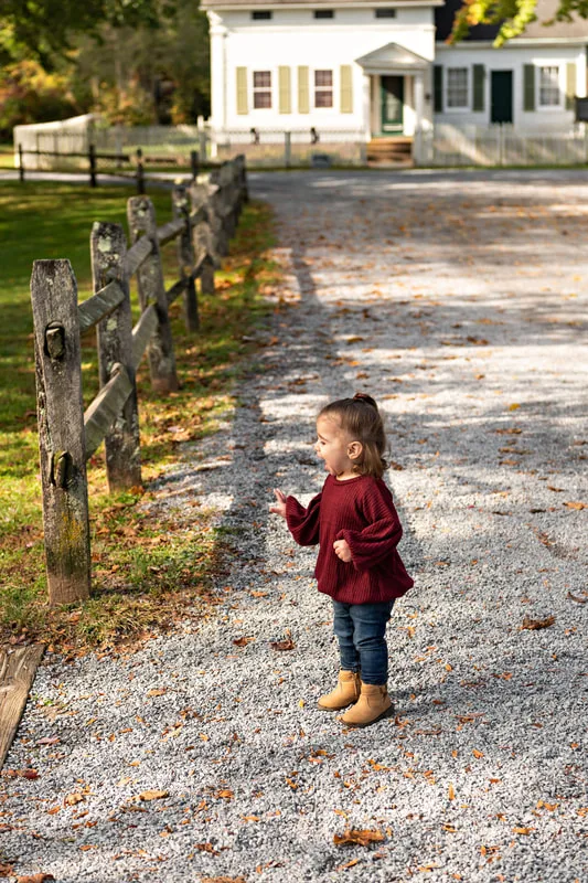 photo of a baby girl in profile smiling
