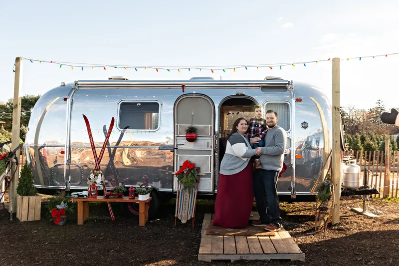 photo of a mom, dad, and son at the Waterdrinker Family Farm Winter Wonderland Festival