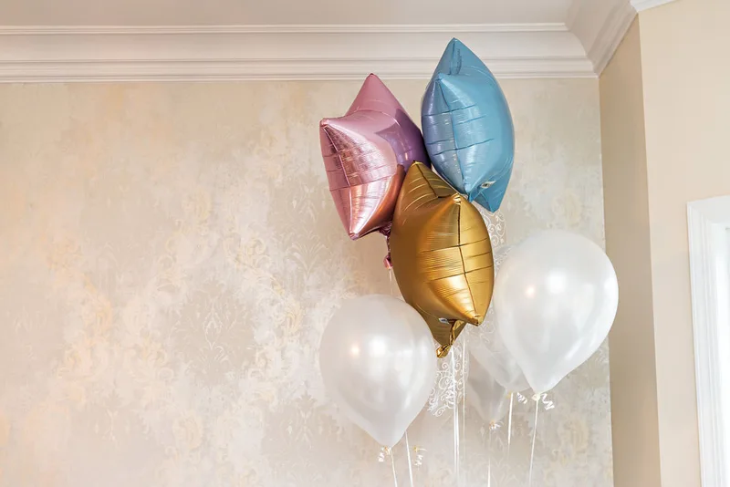 picture of a colorful bouquet of balloons at a gender reveal party 