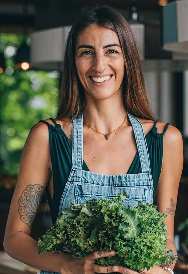 Maria Lamar with greens in the hands