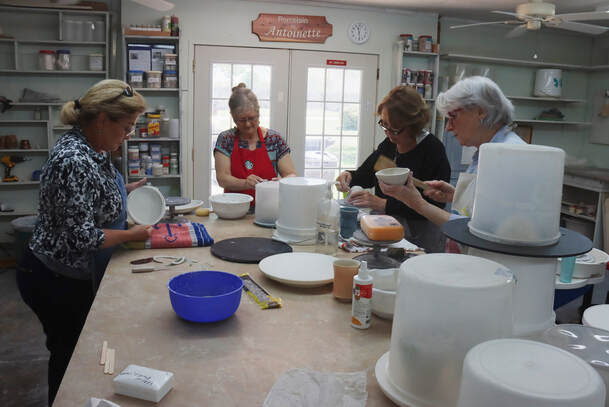 Porcelain workshop participants working side by side in Antoinette Badenhorst's Saltillo, Mississippi studio.