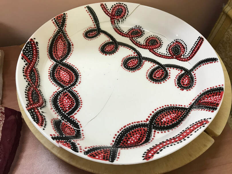 Dunting cracks showing on this wheel thrown porcelain plate. 