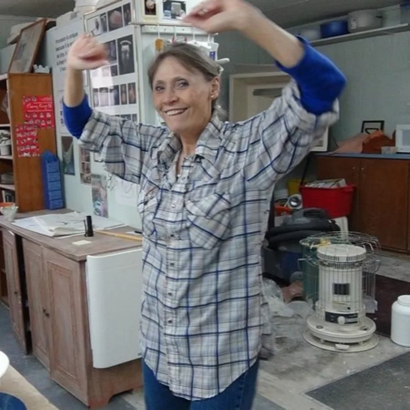 Antoinette Badenhorst is dancing in her pottery studio during a recording break. She is recording an online workshop with the title "Handbuilding Pottery for the Beginner". This is for the online ceramic school TeachinArt.