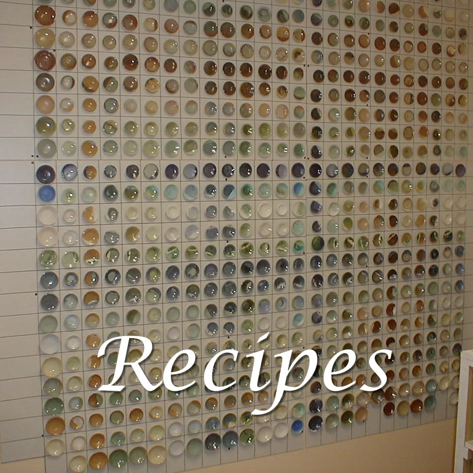 This picture shows many pottery bowls with glazes that Antoinette Badenhorst tested on her own porcelain clay mediums.