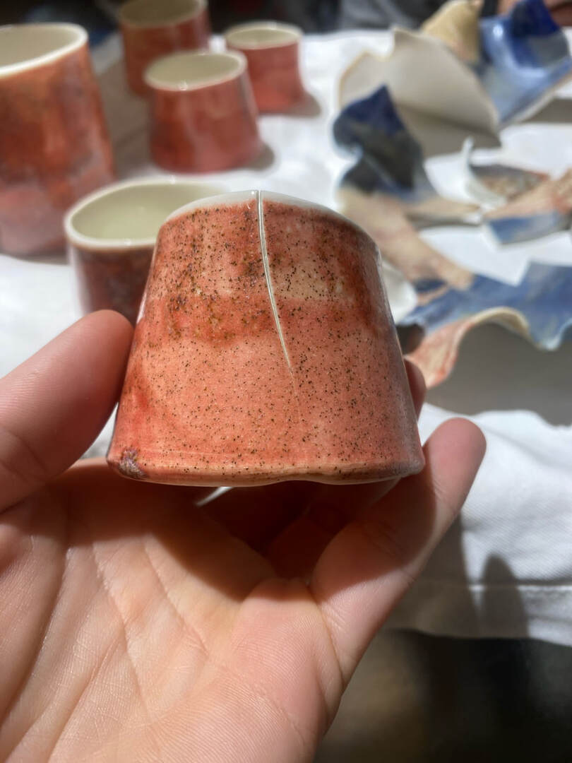 This little porcelain cup cracked from the rim almost to the bottom. 