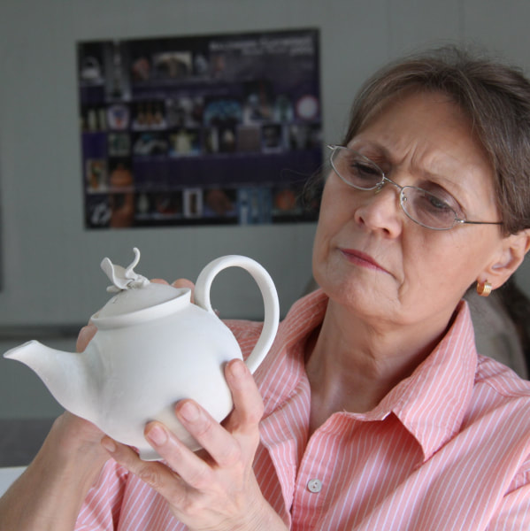Antoinette Badenhorst shows how to design and place a handle on a teapot so that it complements the teapot design and functionality. This online class is for wheel-thrown teapots.