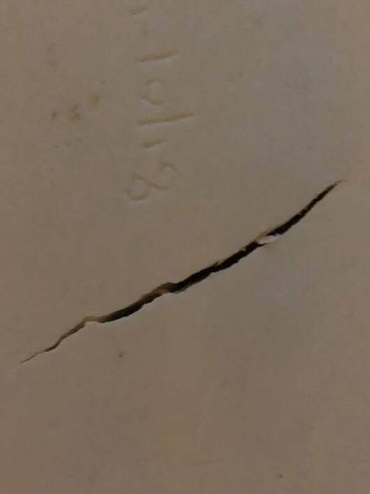 This crack was seen on the bottom of a vessel before it was fired. 