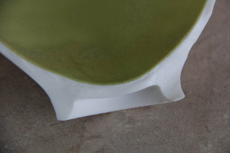 This is a clear image of a dunting crack because of too much glaze on the inside of this bowl. 